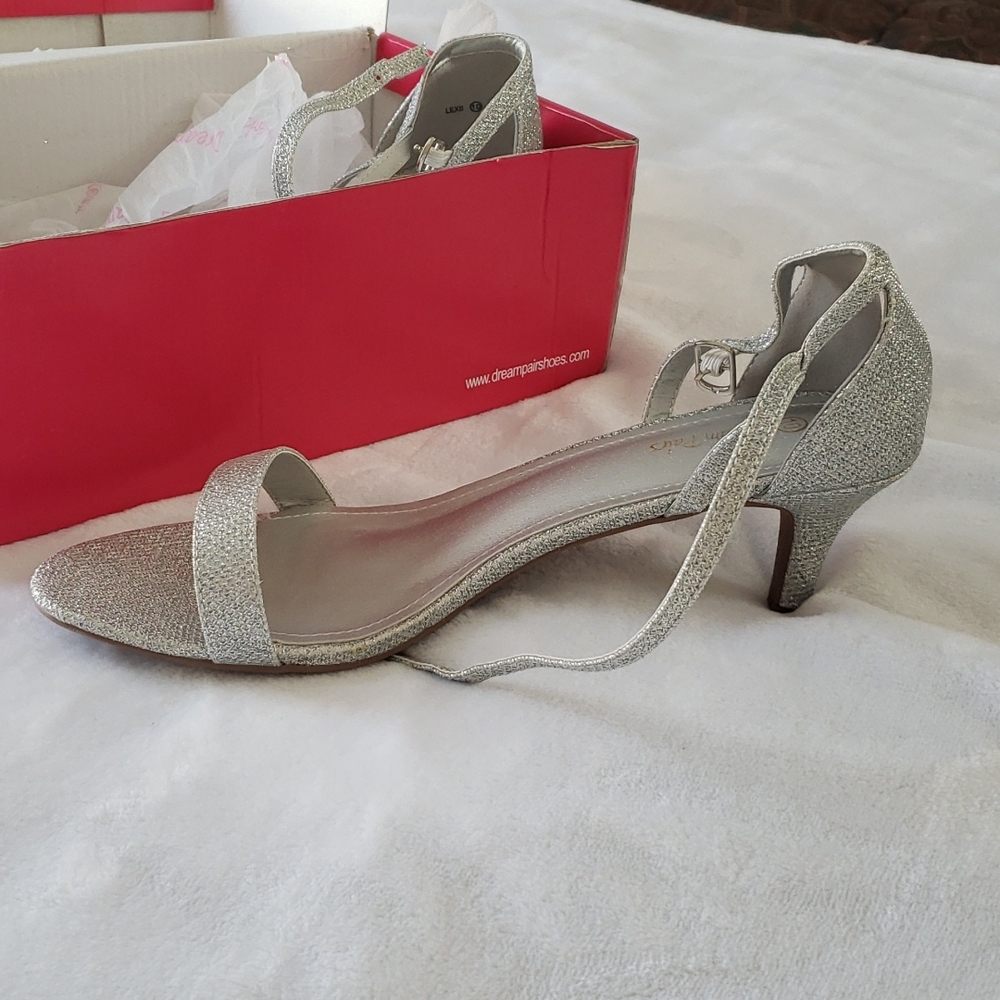 Silver heels never worn. New in box.